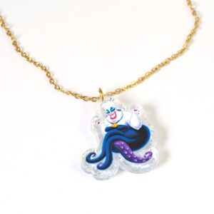Κολιέ με Ούρσουλα η μικρή γοργόνα σε διάφανο glitter plexiglass 28x26 σε cross πλακέ χρυσή αλυσίδα ατσάλι 1.5mm μήκους 39cm και επέκταση 5cm