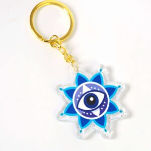 Μπρελόκ έτοιμο με Santorini Evil Eye σε διάφανο glitter plexiglass 50x48mm και χρυσό κρίκο μεταλλικό με αλυσίδα 30mm