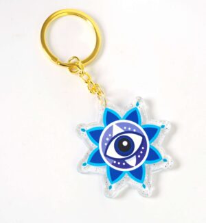 Μπρελόκ έτοιμο με Santorini Evil Eye σε διάφανο glitter plexiglass 50x48mm και χρυσό κρίκο μεταλλικό με αλυσίδα 30mm