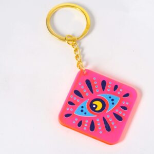Μπρελόκ έτοιμο με Ιθάκη Evil Eye ρόμβος σε ρόζ neon plexiglass 54x54mm και χρυσό κρίκο μεταλλικό με αλυσίδα 30mm